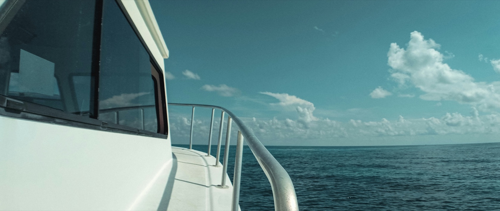 Boat with tinted cabin glass on the water near Panama City Beach, FL