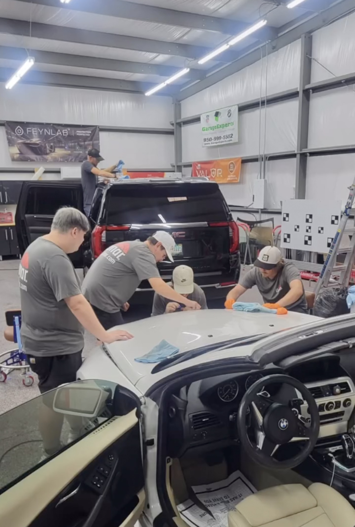 The Exzact Window Tinting crew at work in the Panama City Beach shop